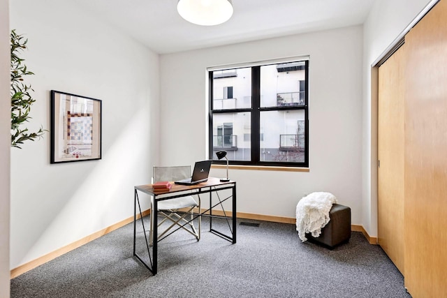 office featuring baseboards and carpet floors