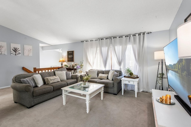 living room featuring vaulted ceiling and light colored carpet