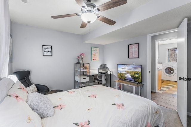 bedroom featuring ceiling fan and washer and dryer