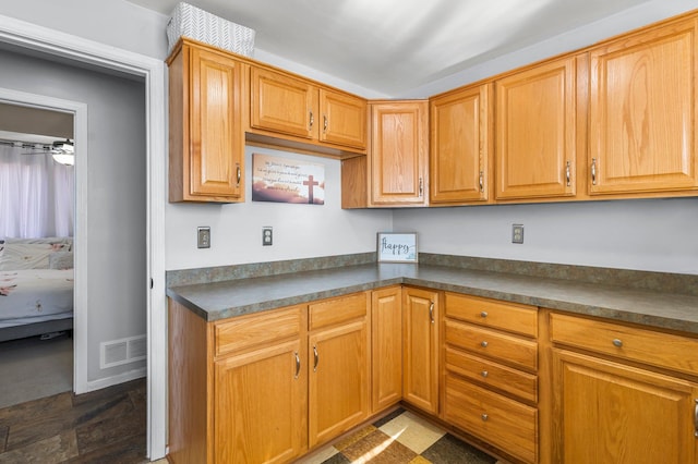 kitchen featuring dark countertops and visible vents