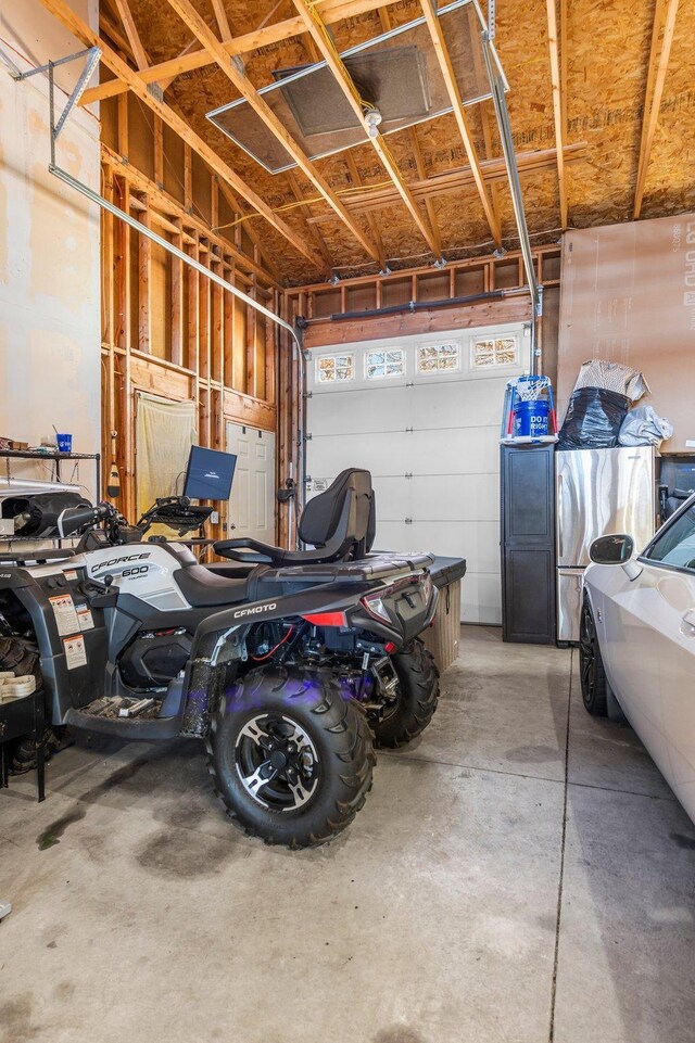 garage with freestanding refrigerator