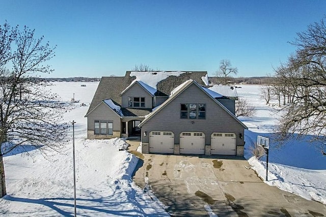 view of front of property featuring an attached garage and driveway