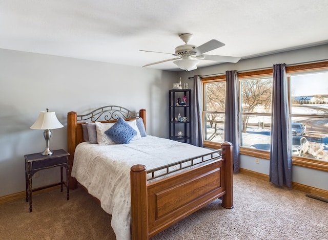 bedroom with carpet floors, baseboards, and a ceiling fan