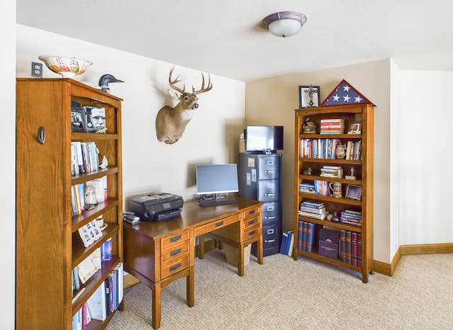 home office featuring light colored carpet and baseboards