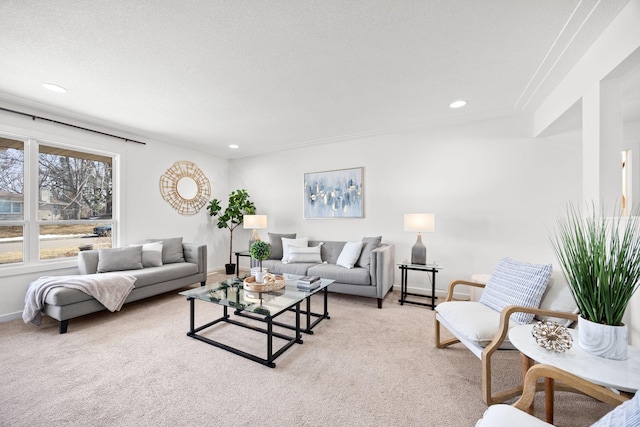 living room featuring recessed lighting, baseboards, light carpet, and a textured ceiling