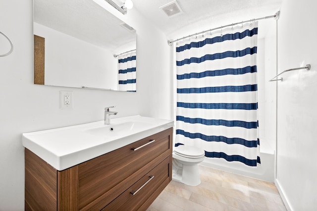 bathroom with vanity, toilet, shower / bathtub combination with curtain, and visible vents