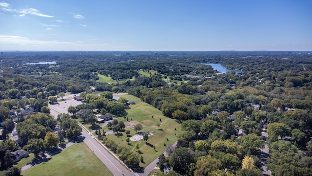 bird's eye view featuring a forest view and a water view