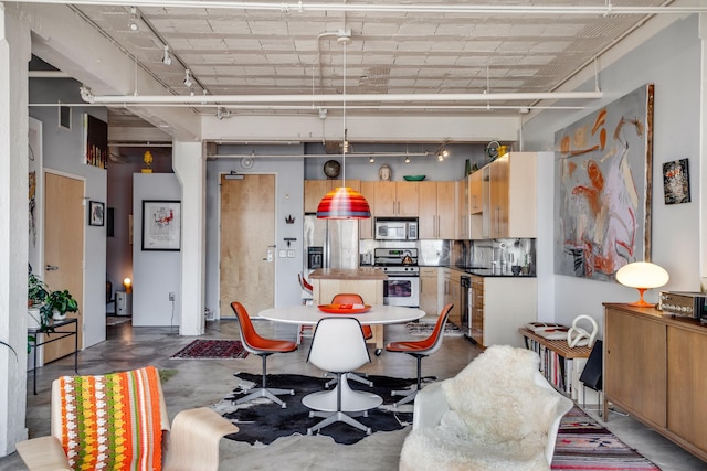 225 9th St E Unit 504, Saint Paul, MN 55101 - dining room featuring finished concrete floors