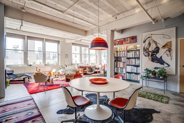 225 9th St E Unit 504, Saint Paul, MN 55101 - dining area featuring concrete flooring and plenty of natural light
