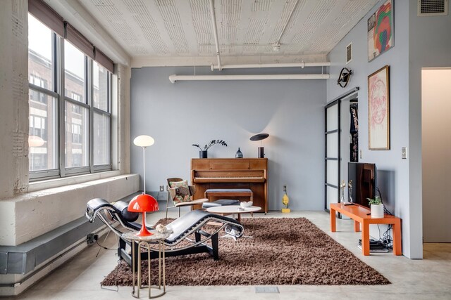 225 9th St E Unit 504, Saint Paul, MN 55101 - living area with finished concrete flooring and track lighting