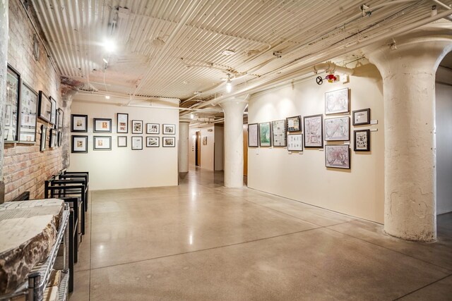 225 9th St E Unit 504, Saint Paul, MN 55101 - hall featuring finished concrete flooring, decorative columns, and arched walkways