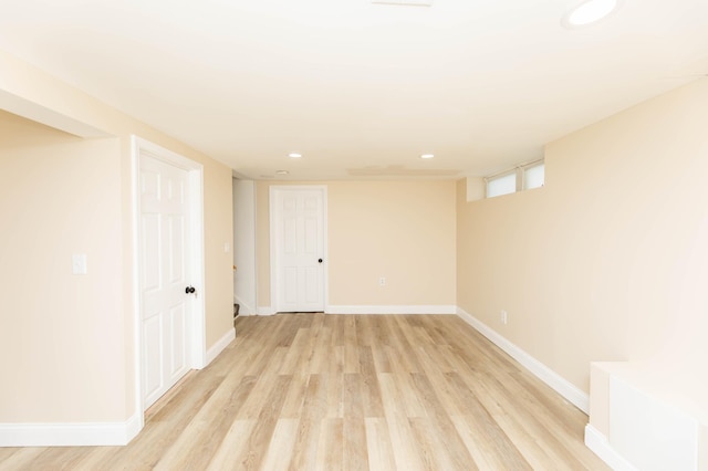 basement featuring recessed lighting, light wood-style flooring, and baseboards