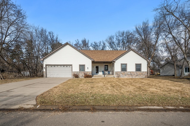 ranch-style house featuring a porch, concrete driveway, a front yard, stone siding, and an attached garage