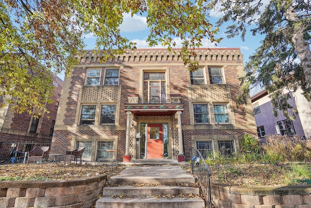 view of front of house with brick siding