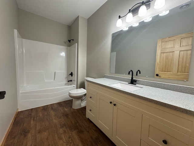 bathroom featuring shower / bath combination, vanity, toilet, and wood finished floors