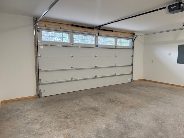 garage with baseboards, electric panel, and a garage door opener