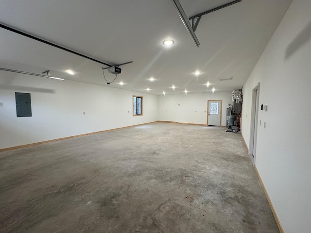 garage with electric panel, baseboards, and a garage door opener