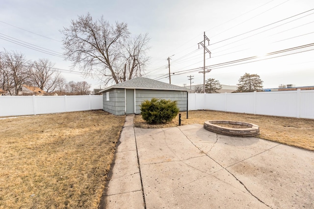 exterior space featuring a patio area, a fire pit, and a fenced backyard