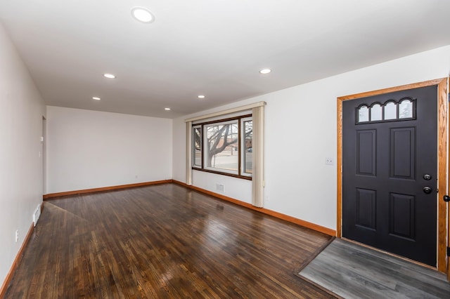 foyer featuring recessed lighting, visible vents, baseboards, and wood finished floors