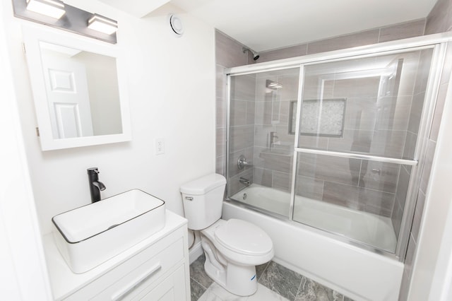 full bath featuring enclosed tub / shower combo, toilet, and a sink