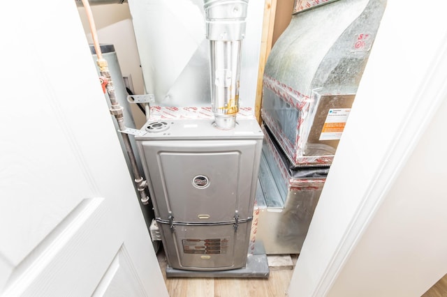 utility room with heating unit