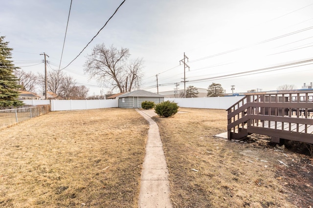 view of yard featuring a deck and a fenced backyard