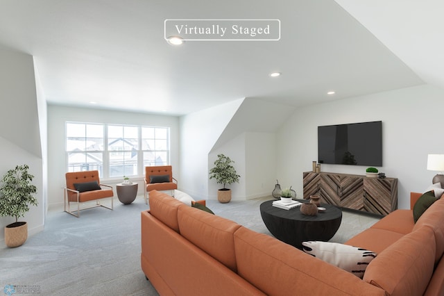 carpeted living area featuring recessed lighting and baseboards