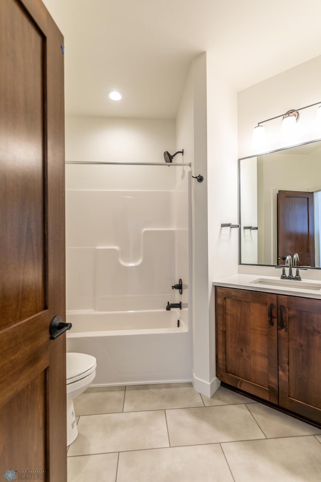 full bath with tile patterned flooring, toilet,  shower combination, and vanity
