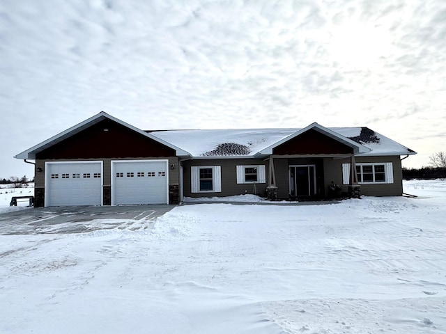 ranch-style house featuring a garage