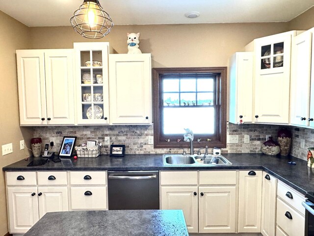 kitchen featuring glass insert cabinets, white cabinetry, dishwasher, and a sink