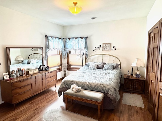 bedroom with wood finished floors