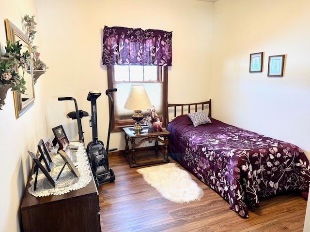 bedroom with wood finished floors