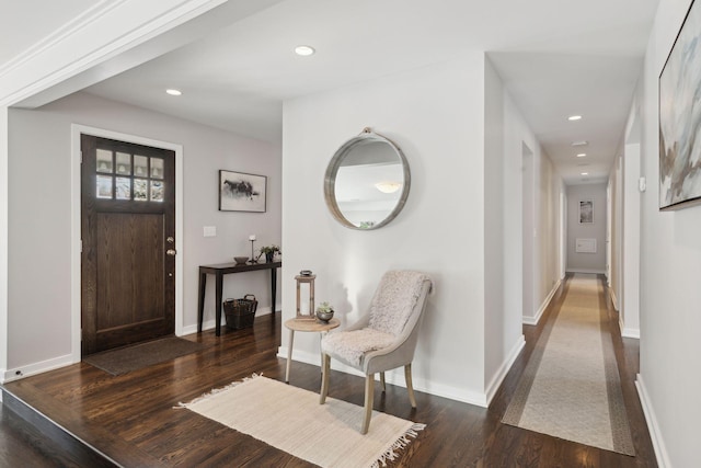 entrance foyer with dark wood-style floors, recessed lighting, and baseboards