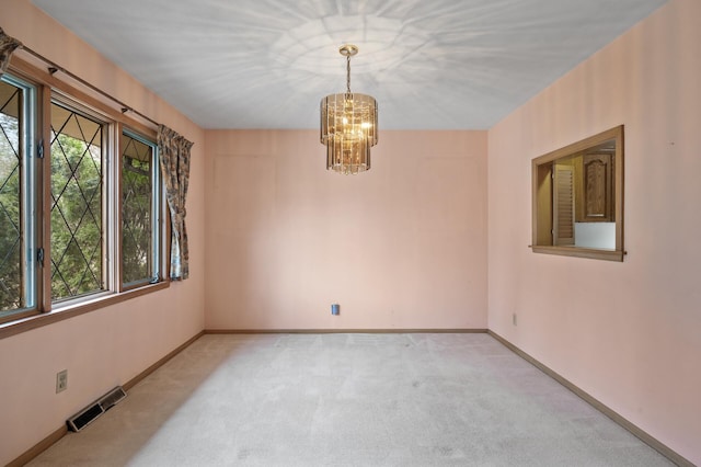 2905 Lake Blvd N, Saint Paul, MN 55109 - carpeted spare room featuring plenty of natural light, a chandelier, and baseboards