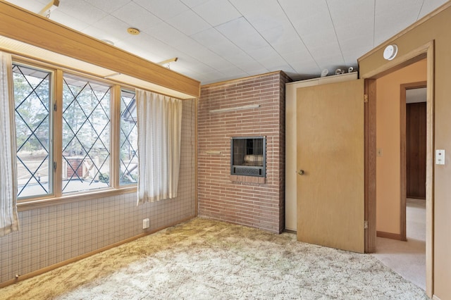 2905 Lake Blvd N, Saint Paul, MN 55109 - unfurnished room featuring carpet floors, a fireplace, and a smoke detector