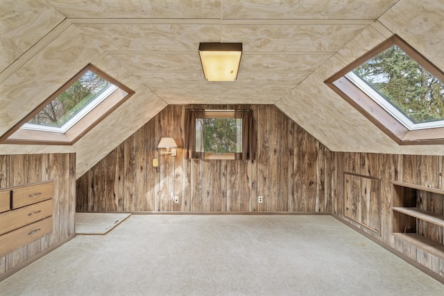 2905 Lake Blvd N, Saint Paul, MN 55109 - additional living space with a skylight, vaulted ceiling, carpet floors, and wood walls