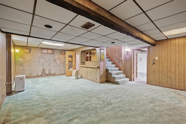 2905 Lake Blvd N, Saint Paul, MN 55109 - finished below grade area with a drop ceiling, carpet floors, wood walls, stairs, and baseboards
