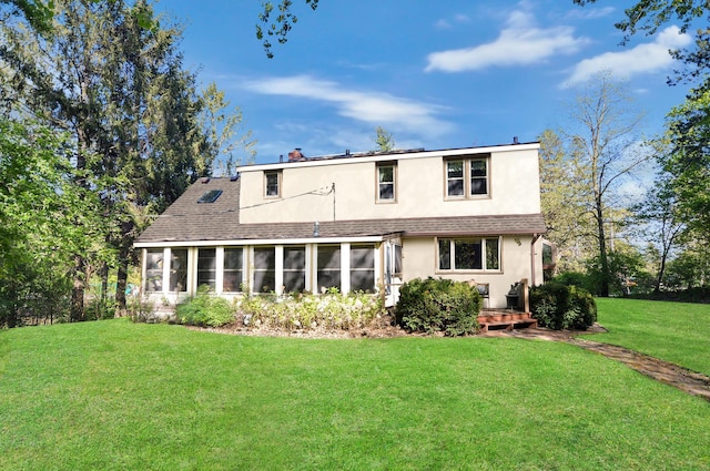 2905 Lake Blvd N, Saint Paul, MN 55109 - back of house with a sunroom, stucco siding, a lawn, and a shingled roof