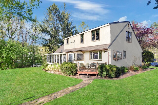 2905 Lake Blvd N, Saint Paul, MN 55109 - back of house with stucco siding, a deck, a yard, and a shingled roof