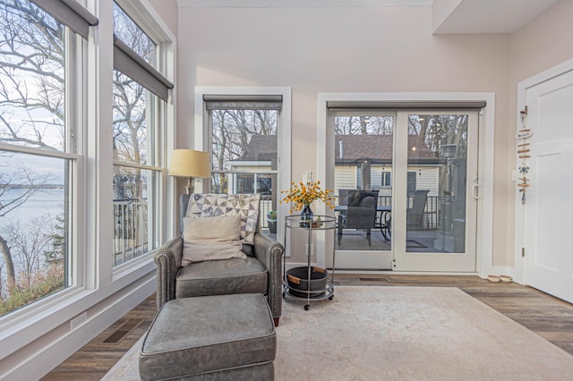 sunroom / solarium featuring visible vents and plenty of natural light