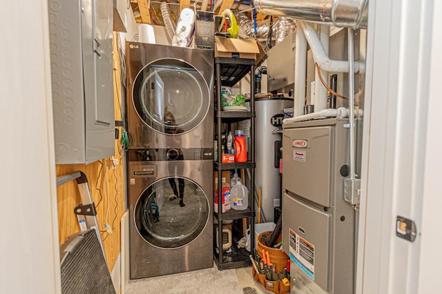 utilities featuring water heater and stacked washer / drying machine