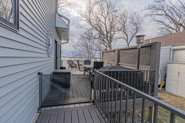 wooden deck with outdoor dining area