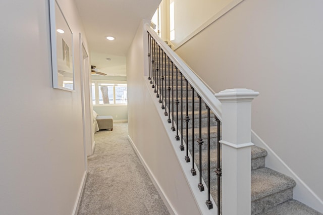 staircase with recessed lighting, carpet flooring, a ceiling fan, and baseboards