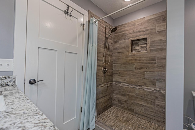 bathroom featuring a tile shower