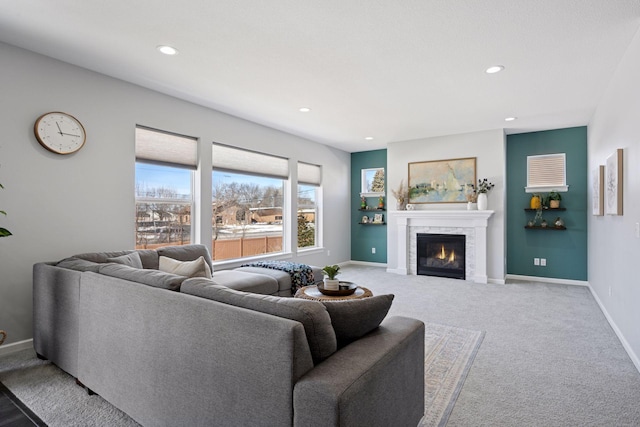 living area featuring recessed lighting, baseboards, carpet flooring, and a tiled fireplace