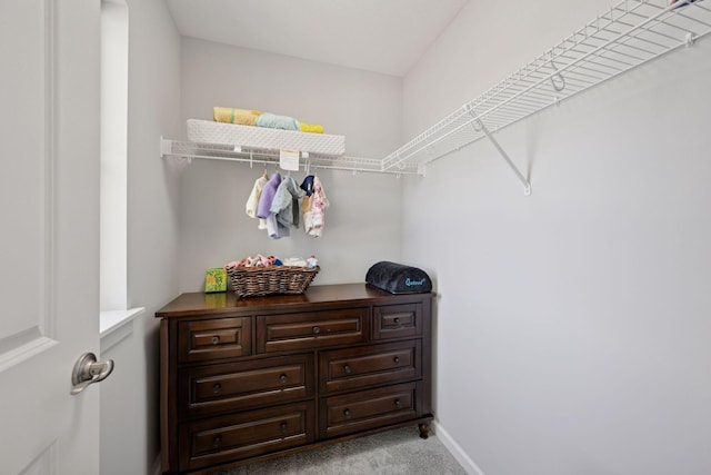 spacious closet with carpet floors