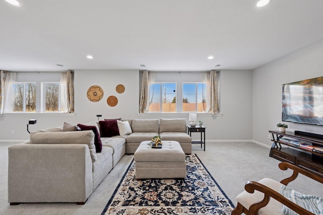 living room featuring recessed lighting, baseboards, and carpet floors