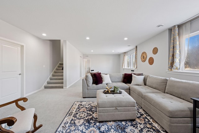 living room with recessed lighting, baseboards, carpet floors, and stairs