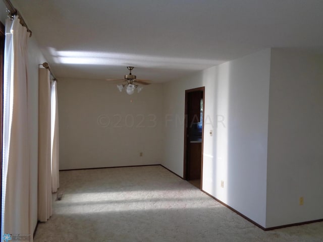 hallway featuring light carpet