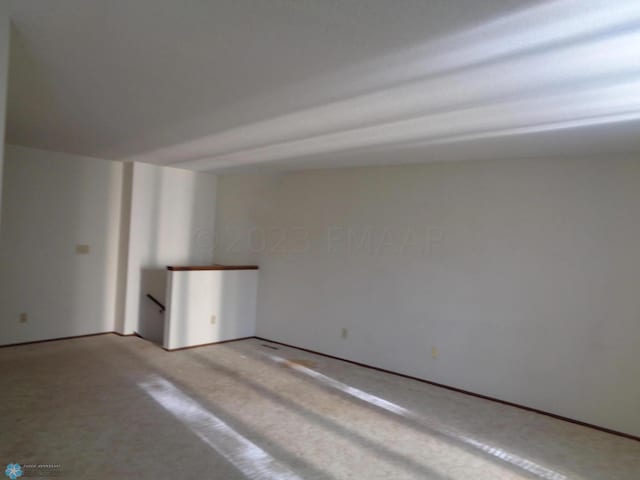 empty room with light colored carpet